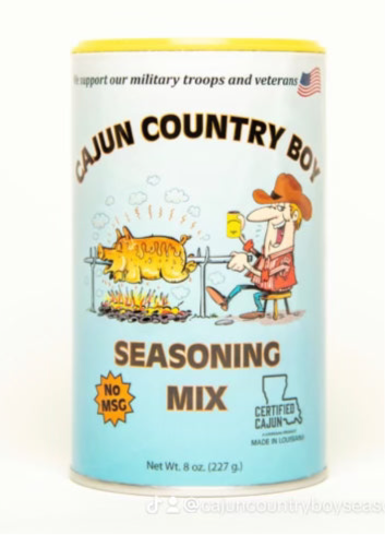 Cajun Country Boy regular seasoning can. This three-pack includes three 8 oz (227 g) cans; one can is pictured.
