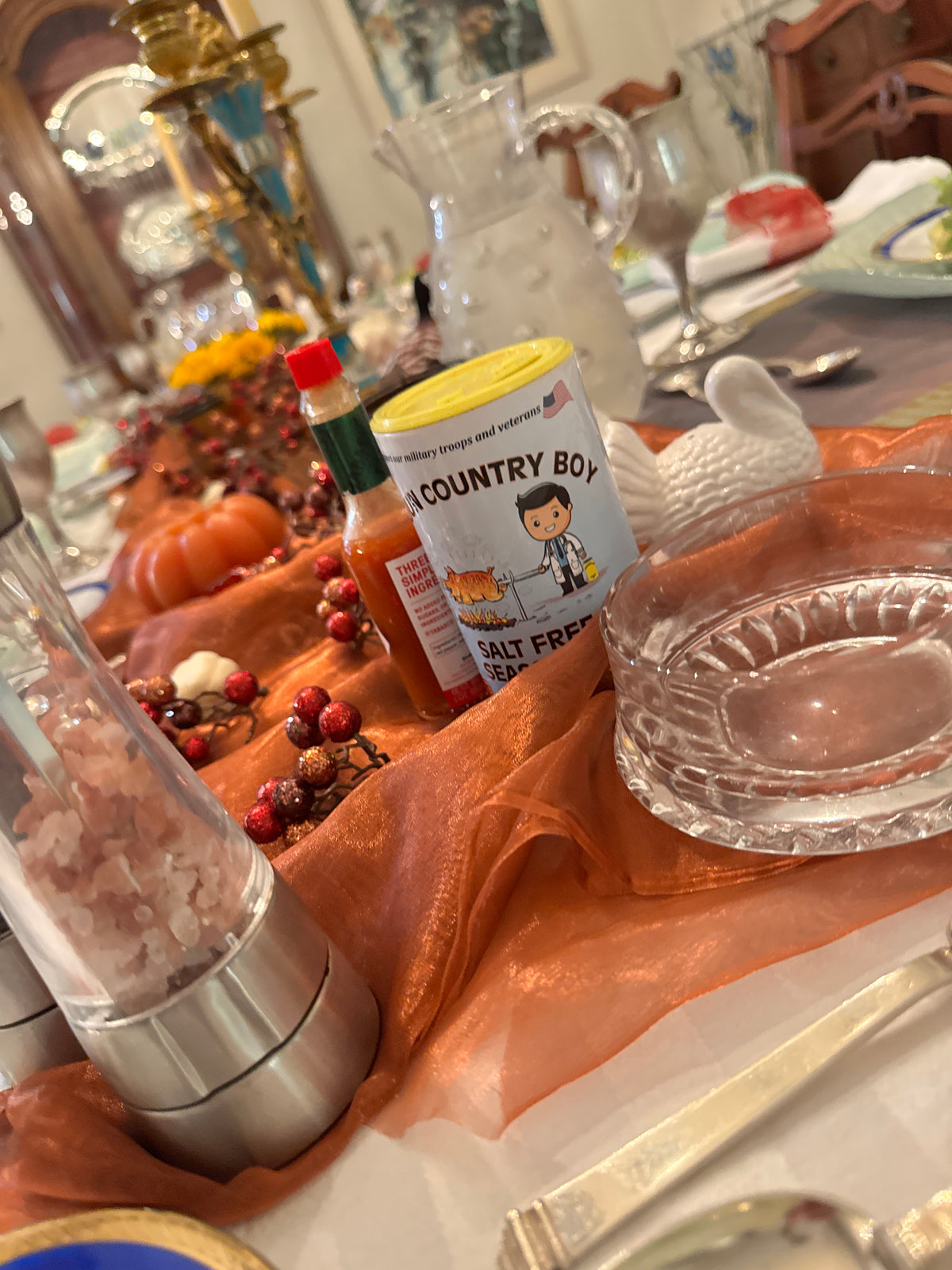 Cajun Country Boy Salt-Free Seasoning can on an autumn dining table.